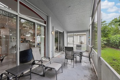 Spacious, meticulously maintained home in a gated community with on Woodmont Country Club in Florida - for sale on GolfHomes.com, golf home, golf lot