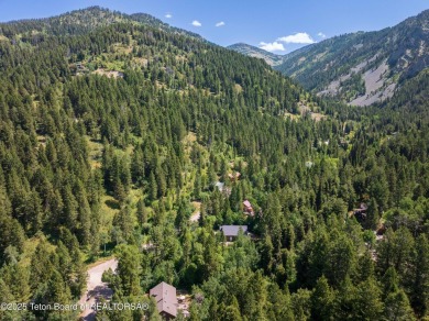 Tucked into the trees on a quiet street in Star Valley Ranch on Star Valley RV Golf Course in Wyoming - for sale on GolfHomes.com, golf home, golf lot