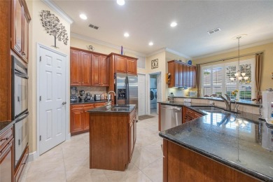 Magnificent 6-Bedroom Pool Home with Golf Course Views in on Magnolia Plantation Golf Club in Florida - for sale on GolfHomes.com, golf home, golf lot