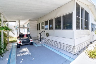 GOLF CART INCLUDED Beautifully updated split-bedroom home on Barefoot Bay Golf Course in Florida - for sale on GolfHomes.com, golf home, golf lot
