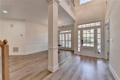 Discover a meticulously designed home that seamlessly blends on Canongate At Olde Atlanta Golf Club in Georgia - for sale on GolfHomes.com, golf home, golf lot