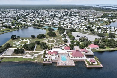 GOLF CART INCLUDED Beautifully updated split-bedroom home on Barefoot Bay Golf Course in Florida - for sale on GolfHomes.com, golf home, golf lot