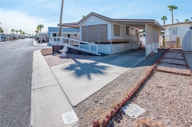 Corner Lot Retreat with Deck and Spacious Bonus Room in on Riverview Golf Course in Arizona - for sale on GolfHomes.com, golf home, golf lot