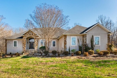 Custom European-style stucco and stone home in a 18-hole golf on Madisonville Golf and Country Club in Kentucky - for sale on GolfHomes.com, golf home, golf lot