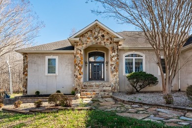 Custom European-style stucco and stone home in a 18-hole golf on Madisonville Golf and Country Club in Kentucky - for sale on GolfHomes.com, golf home, golf lot