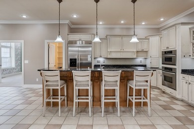 Custom European-style stucco and stone home in a 18-hole golf on Madisonville Golf and Country Club in Kentucky - for sale on GolfHomes.com, golf home, golf lot