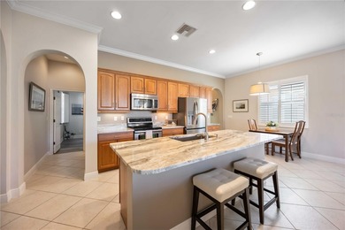 Modern updates welcome you as you step through the front door of on Venetian Golf and River Club in Florida - for sale on GolfHomes.com, golf home, golf lot