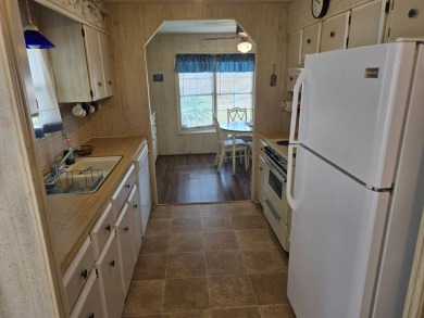 OWNER WILL CONSIDER FINANCING OPTION! Palm trees line the front on Grasslands Golf and Country Club in Florida - for sale on GolfHomes.com, golf home, golf lot