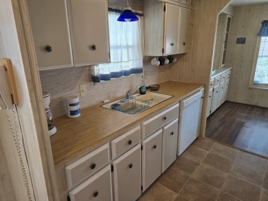 OWNER WILL CONSIDER FINANCING OPTION! Palm trees line the front on Grasslands Golf and Country Club in Florida - for sale on GolfHomes.com, golf home, golf lot
