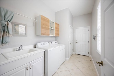 Modern updates welcome you as you step through the front door of on Venetian Golf and River Club in Florida - for sale on GolfHomes.com, golf home, golf lot