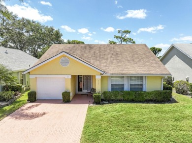 This single-level home with a BRAND NEW ROOF has soaring vaulted on The Golf Club of Jupiter in Florida - for sale on GolfHomes.com, golf home, golf lot