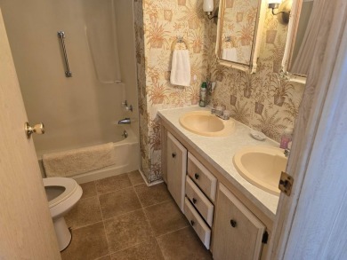OWNER WILL CONSIDER FINANCING OPTION! Palm trees line the front on Grasslands Golf and Country Club in Florida - for sale on GolfHomes.com, golf home, golf lot