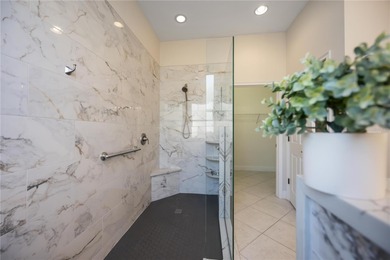 Modern updates welcome you as you step through the front door of on Venetian Golf and River Club in Florida - for sale on GolfHomes.com, golf home, golf lot