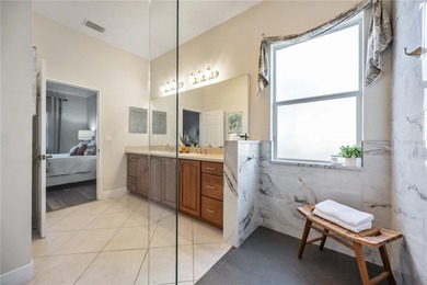 Modern updates welcome you as you step through the front door of on Venetian Golf and River Club in Florida - for sale on GolfHomes.com, golf home, golf lot