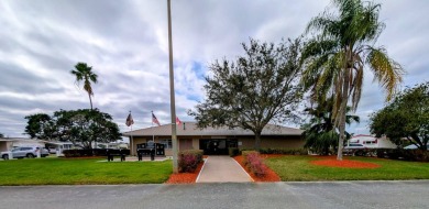 OWNER WILL CONSIDER FINANCING OPTION! Palm trees line the front on Grasslands Golf and Country Club in Florida - for sale on GolfHomes.com, golf home, golf lot