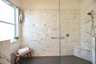 Modern updates welcome you as you step through the front door of on Venetian Golf and River Club in Florida - for sale on GolfHomes.com, golf home, golf lot