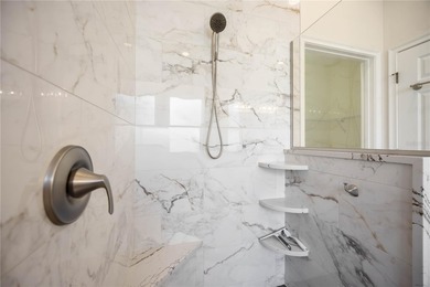 Modern updates welcome you as you step through the front door of on Venetian Golf and River Club in Florida - for sale on GolfHomes.com, golf home, golf lot