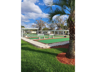 OWNER WILL CONSIDER FINANCING OPTION! Palm trees line the front on Grasslands Golf and Country Club in Florida - for sale on GolfHomes.com, golf home, golf lot
