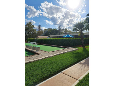 OWNER WILL CONSIDER FINANCING OPTION! Palm trees line the front on Grasslands Golf and Country Club in Florida - for sale on GolfHomes.com, golf home, golf lot
