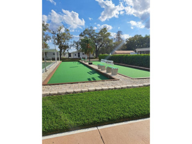 OWNER WILL CONSIDER FINANCING OPTION! Palm trees line the front on Grasslands Golf and Country Club in Florida - for sale on GolfHomes.com, golf home, golf lot