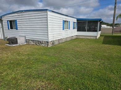 OWNER WILL CONSIDER FINANCING OPTION! Palm trees line the front on Grasslands Golf and Country Club in Florida - for sale on GolfHomes.com, golf home, golf lot