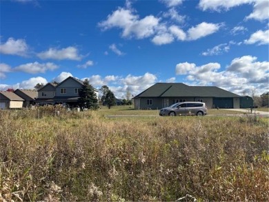 With a wooded backdrop this beautiful lot has great potential on The Amery Golf Club in Wisconsin - for sale on GolfHomes.com, golf home, golf lot