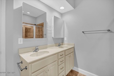 This meticulously maintained all-brick townhome, tucked away on on Cape Fear National At Brunswick Forest in North Carolina - for sale on GolfHomes.com, golf home, golf lot