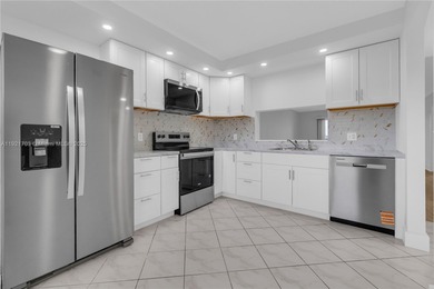 BEST LAKE VIEW & TASTEFULLY REMODELED!!! in Century Village on Flamingo Lakes Country Club in Florida - for sale on GolfHomes.com, golf home, golf lot