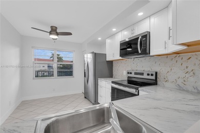 BEST LAKE VIEW & TASTEFULLY REMODELED!!! in Century Village on Flamingo Lakes Country Club in Florida - for sale on GolfHomes.com, golf home, golf lot