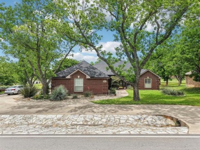 Walk out to the golf course from your large screened in back on Pecan Plantation Country Club in Texas - for sale on GolfHomes.com, golf home, golf lot