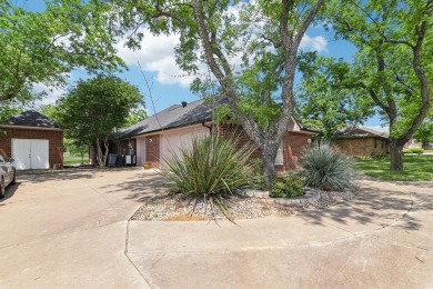 Walk out to the golf course from your large screened in back on Pecan Plantation Country Club in Texas - for sale on GolfHomes.com, golf home, golf lot