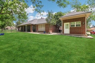 Walk out to the golf course from your large screened in back on Pecan Plantation Country Club in Texas - for sale on GolfHomes.com, golf home, golf lot