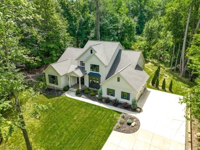 Nestled on over 1.5 wooded acres in Orange School District, this on The Country Club in Ohio - for sale on GolfHomes.com, golf home, golf lot