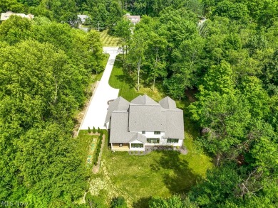 Nestled on over 1.5 wooded acres in Orange School District, this on The Country Club in Ohio - for sale on GolfHomes.com, golf home, golf lot