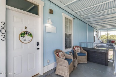 Step into coastal charm with this beautifully updated 2-bedroom on The Bridges Golf Club At Hollywood Casino in Mississippi - for sale on GolfHomes.com, golf home, golf lot