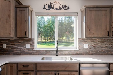 2.25% Assumable VA Loan - Home on the range...the driving range! on Quail Run Golf Course in Oregon - for sale on GolfHomes.com, golf home, golf lot