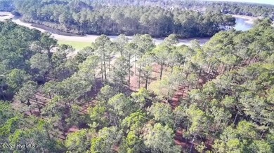 Opportunity knocks! Prime Golf course homesite with pond views on Ocean Ridge Plantation in North Carolina - for sale on GolfHomes.com, golf home, golf lot