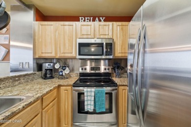 Wake up to the sound of waves and panoramic Gulf views from your on Holiday Golf Club in Florida - for sale on GolfHomes.com, golf home, golf lot