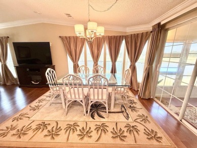 EXQUISTE LAKEFRONT HOME IN A GATED COMMUNITY OFFERING on Cypress Greens in Florida - for sale on GolfHomes.com, golf home, golf lot