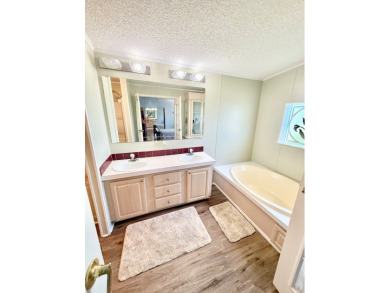 BRING YOUR OFFER ON THIS EXQUISITE LAKEFRONT HOME IN A GATED on Cypress Greens in Florida - for sale on GolfHomes.com, golf home, golf lot