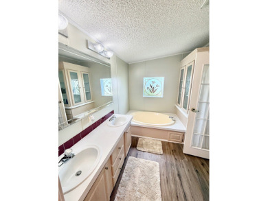 BRING YOUR OFFER ON THIS EXQUISITE LAKEFRONT HOME IN A GATED on Cypress Greens in Florida - for sale on GolfHomes.com, golf home, golf lot