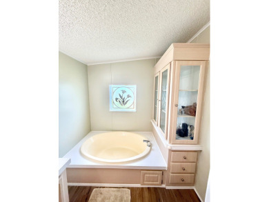 BRING YOUR OFFER ON THIS EXQUISITE LAKEFRONT HOME IN A GATED on Cypress Greens in Florida - for sale on GolfHomes.com, golf home, golf lot