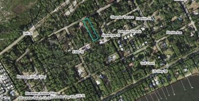 Nestled down Pinewood Avenue in charming Carrabelle, Florida on St. James Bay in Florida - for sale on GolfHomes.com, golf home, golf lot