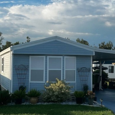 This beautifully updated 2-bedroom, 2-bathroom unfurnished home on Lake Henry Golf Club in Florida - for sale on GolfHomes.com, golf home, golf lot
