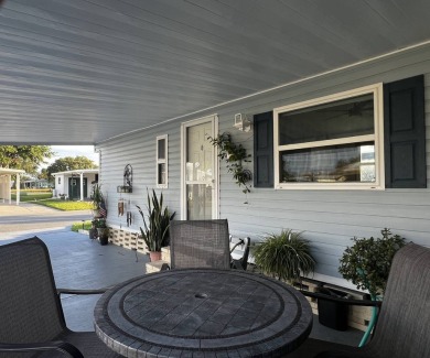 This beautifully updated 2-bedroom, 2-bathroom unfurnished home on Lake Henry Golf Club in Florida - for sale on GolfHomes.com, golf home, golf lot