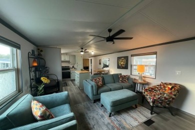 This beautifully updated 2-bedroom, 2-bathroom unfurnished home on Lake Henry Golf Club in Florida - for sale on GolfHomes.com, golf home, golf lot