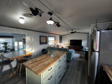 This beautifully updated 2-bedroom, 2-bathroom unfurnished home on Lake Henry Golf Club in Florida - for sale on GolfHomes.com, golf home, golf lot