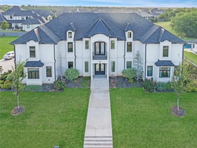 Welcome to a glorious modern residence nestled behind the gates on Oak Tree National Golf and Country Club in Oklahoma - for sale on GolfHomes.com, golf home, golf lot