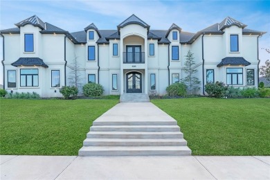 Welcome to a glorious modern residence nestled behind the gates on Oak Tree National Golf and Country Club in Oklahoma - for sale on GolfHomes.com, golf home, golf lot