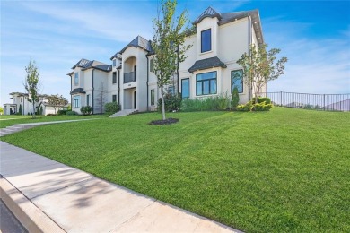 Welcome to a glorious modern residence nestled behind the gates on Oak Tree National Golf and Country Club in Oklahoma - for sale on GolfHomes.com, golf home, golf lot